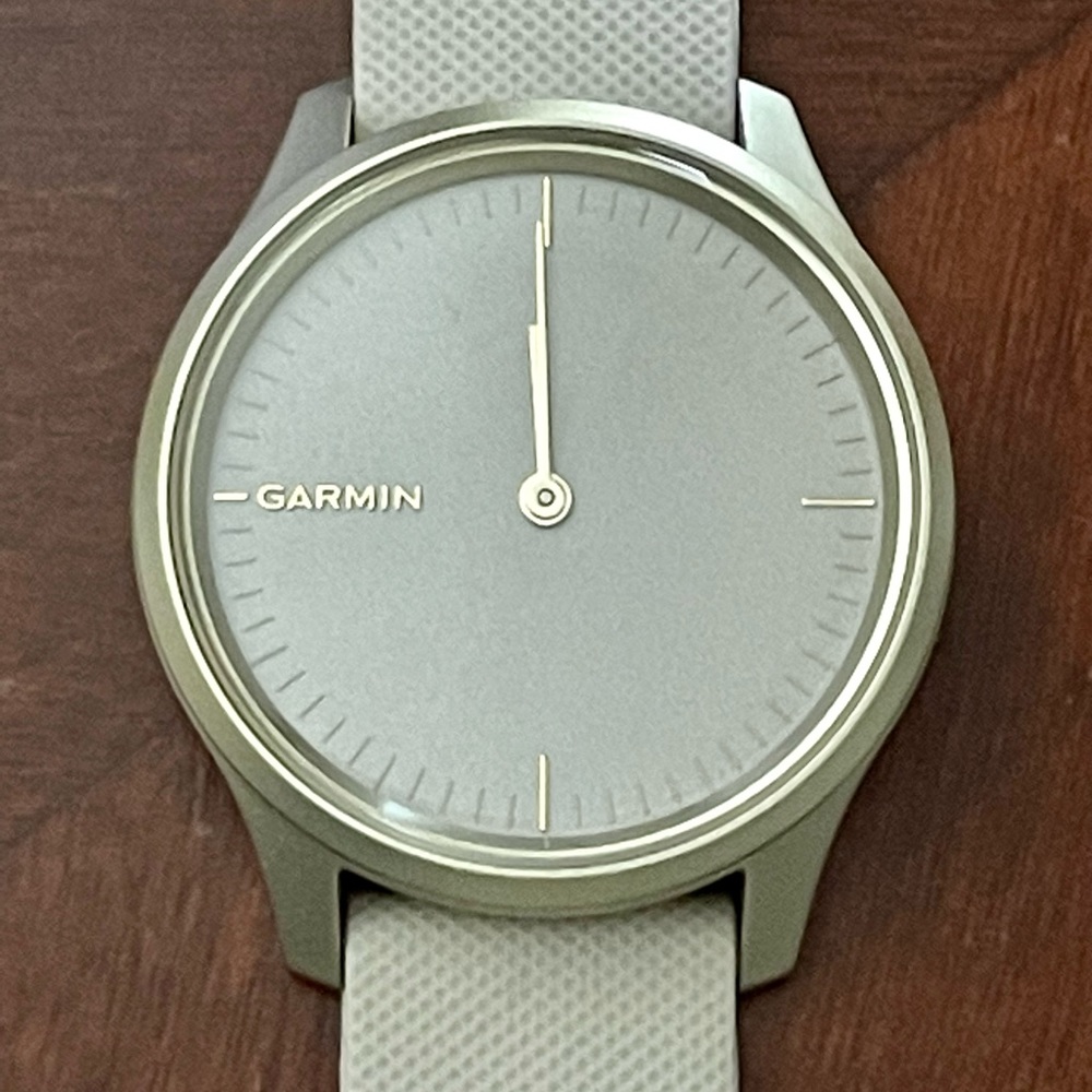 Garmin Vivomove Style - Light gold case with light sand and black bands.